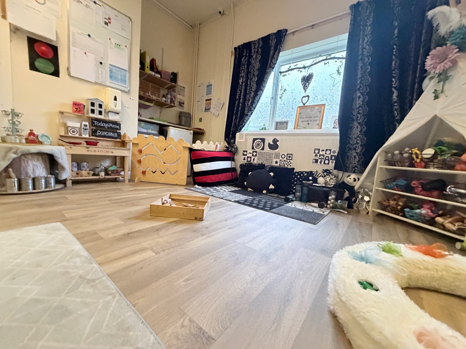 Staff playing with children on the floor